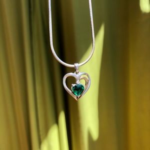 Emerald/Sterling Silver/10k gold heart necklace.